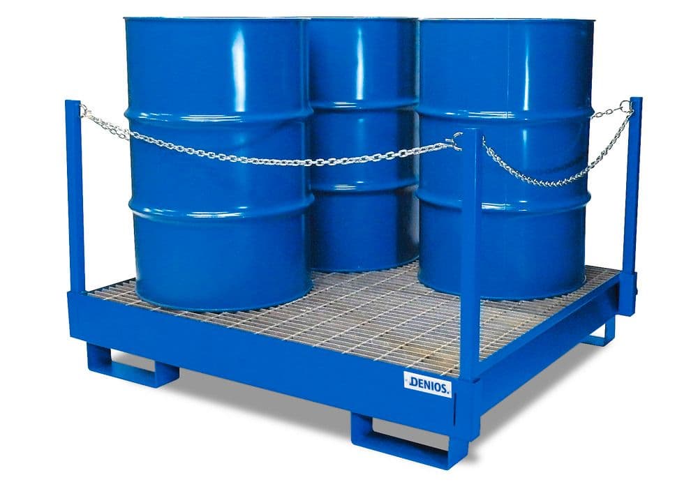 Oil drums on a spill-containment pallet at a service facility