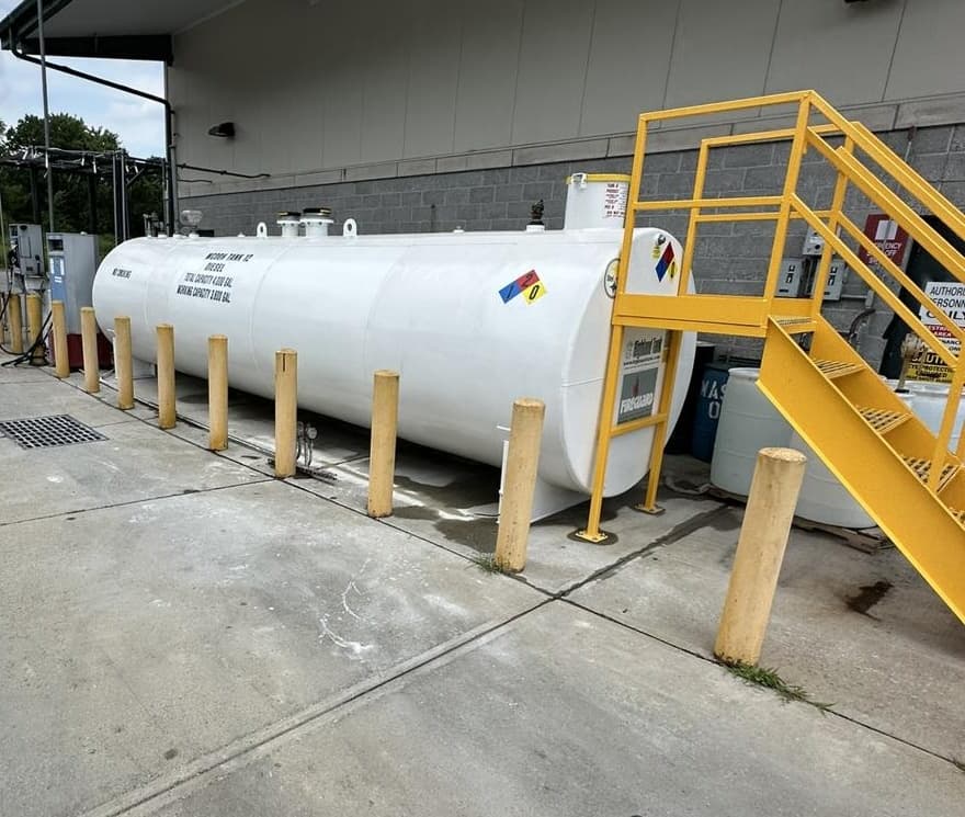 Replacement diesel aboveground storage tank with access stairs at the school-bus facility