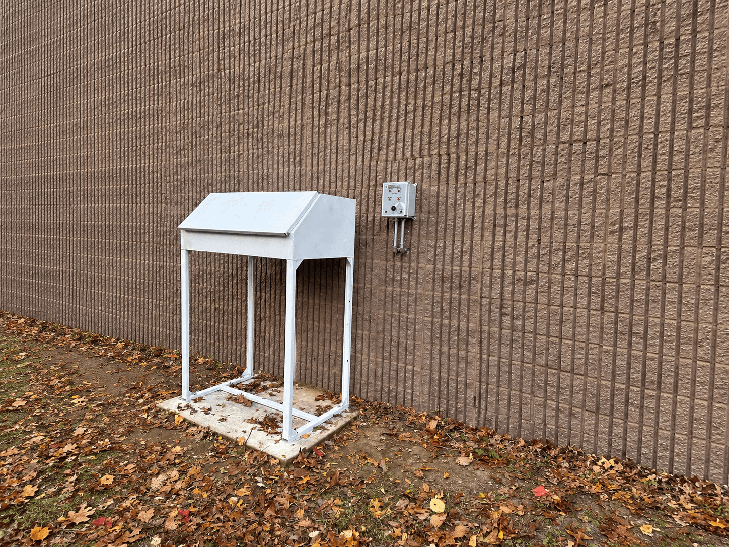 Completed outdoor remote fill-spill box with the adjacent high-level alarm panel