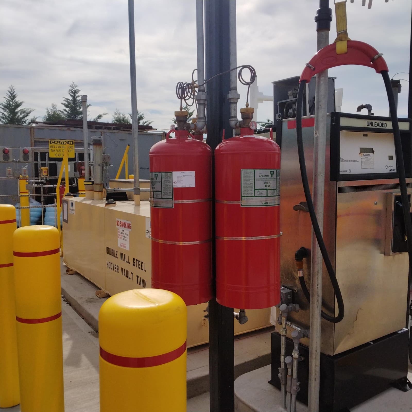 Gasoline dispenser, tank and adjacent fire-suppression equipment