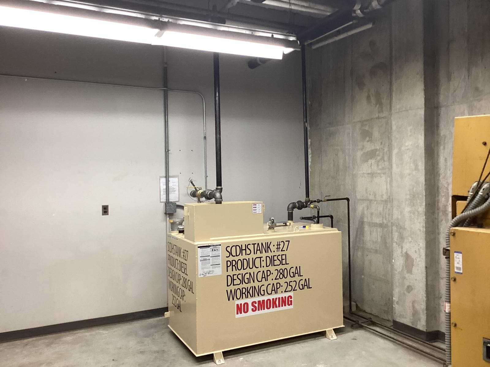 Indoor double-wall diesel tank beside the existing emergency generator