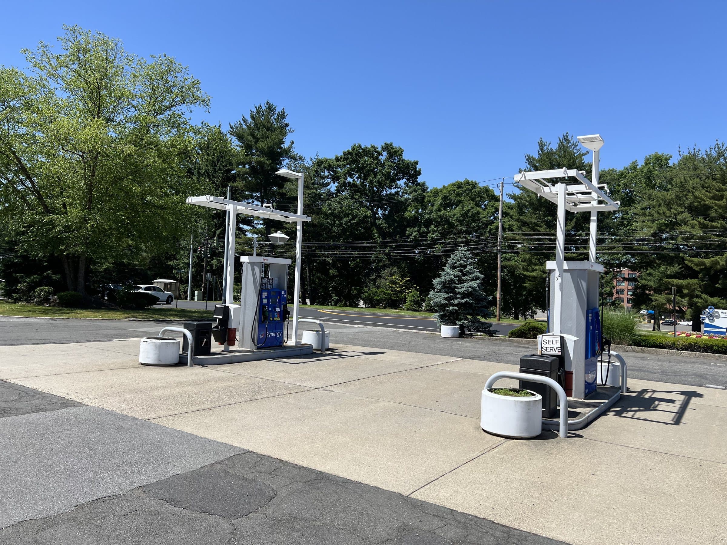 Two fuel dispensing islands with overhead equipment.