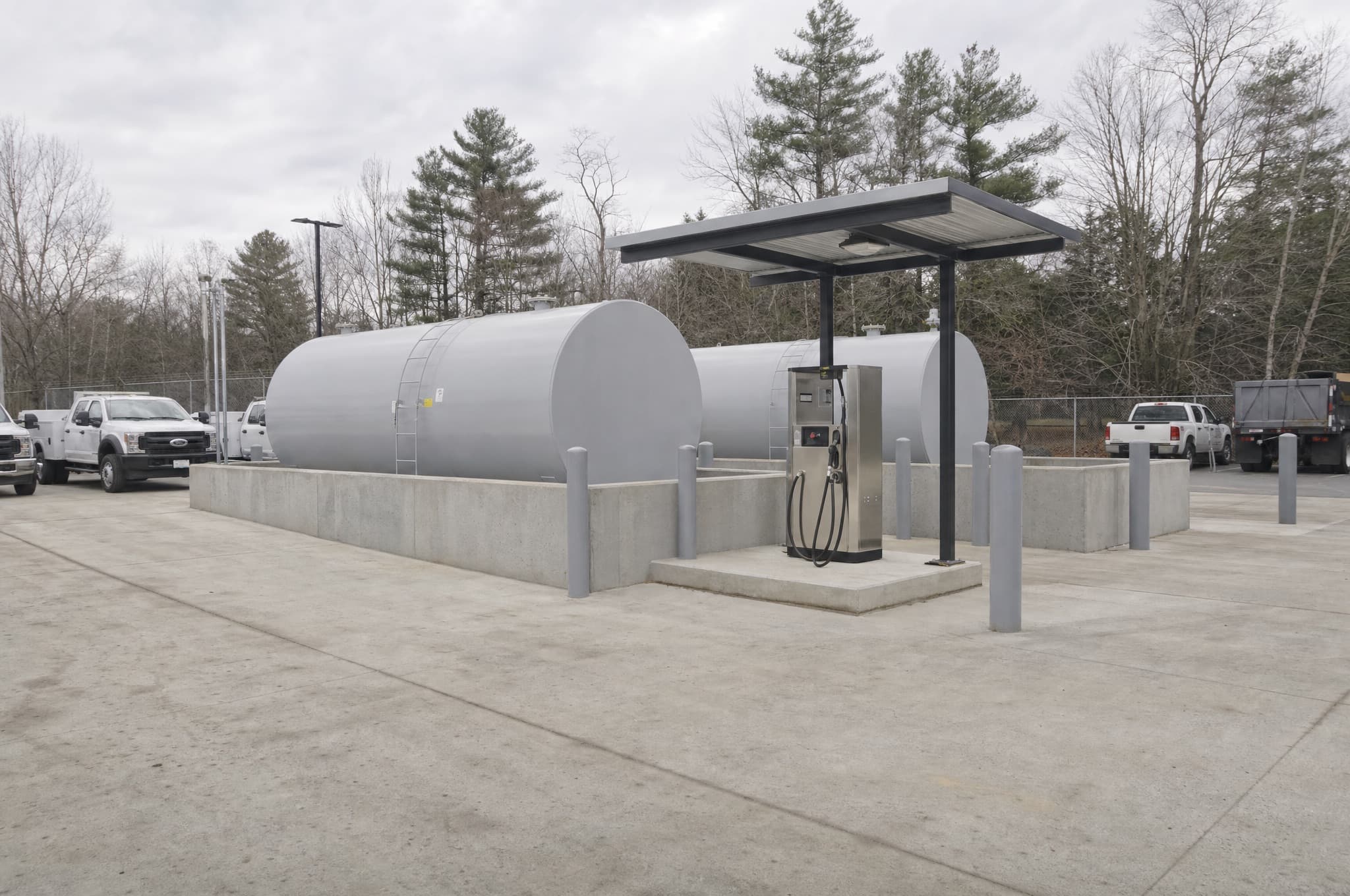 Fuel dispensing island and aboveground storage tank at a fleet fueling facility